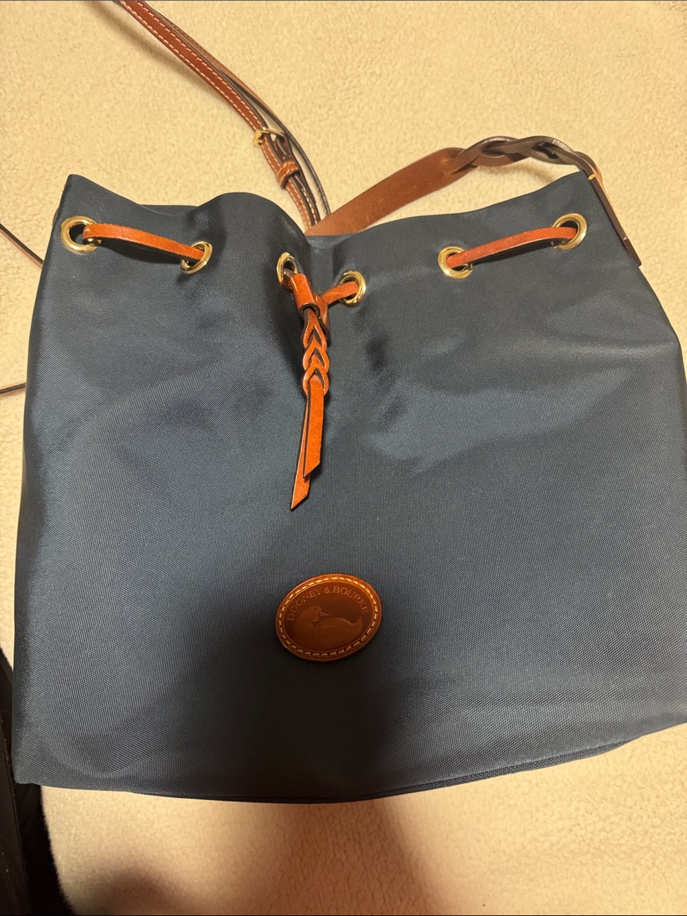 Dooney & Bourke Navy Bucket Messenger Bag with Tan Trim